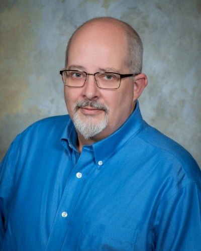 a man in a blue shirt